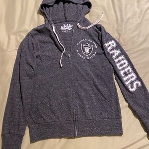 Raiders zip up hoodie. Size Medium.